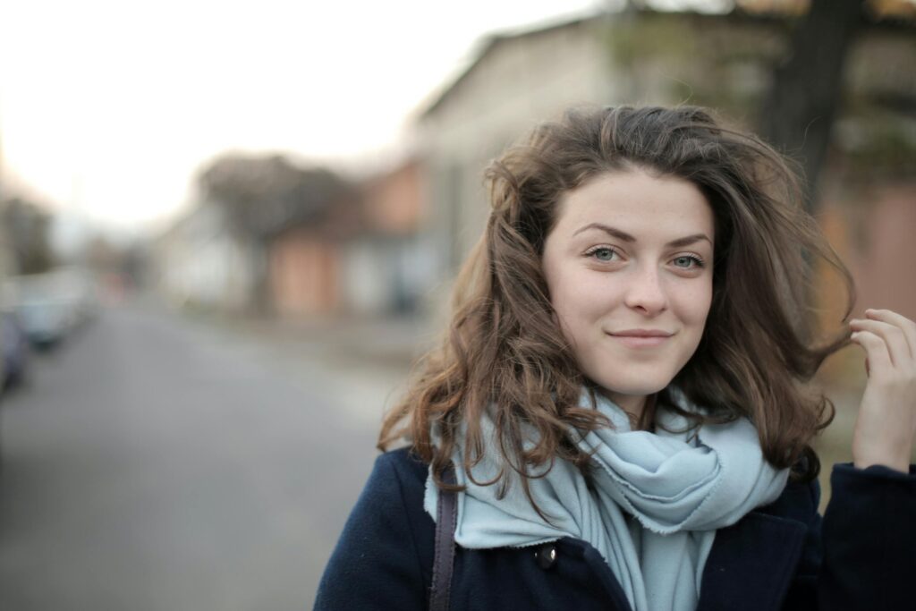 Woman in blue jacket smiling